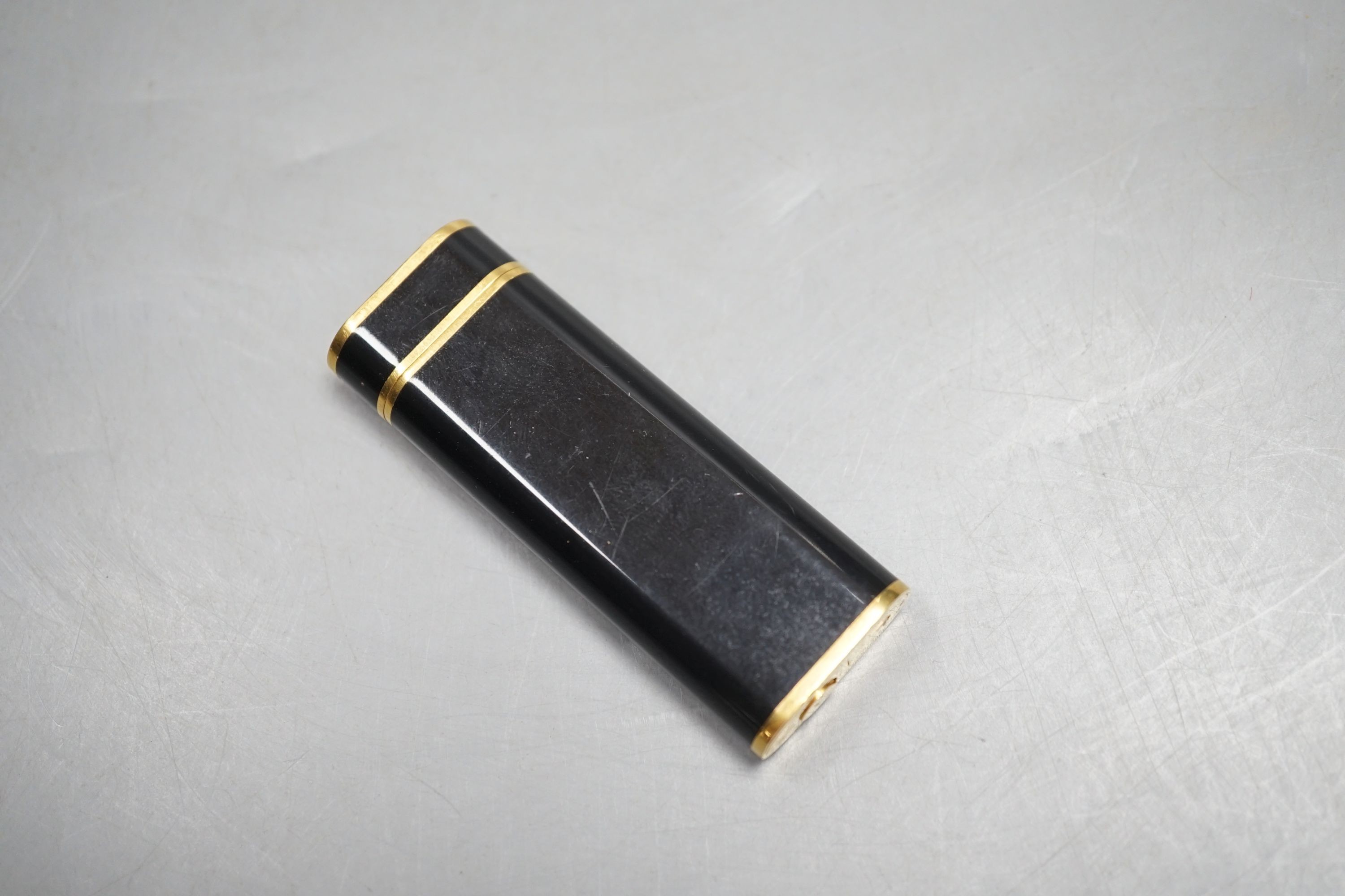 Cartier, black enamel and gold plated lighter